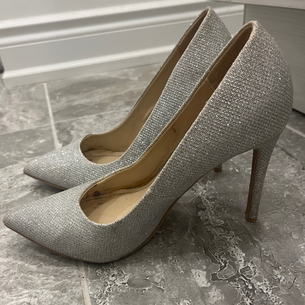 Size 8. Silver metallic heels.